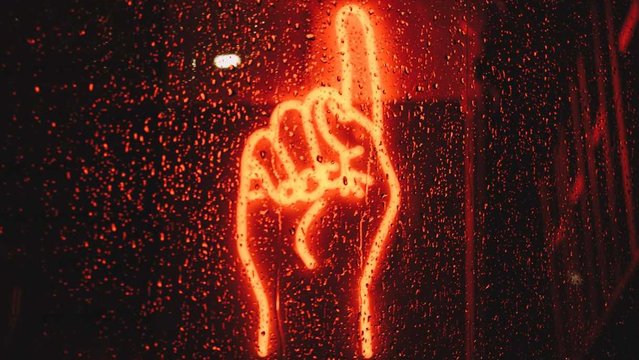 Neonschild von erhobenem Zeigefinger