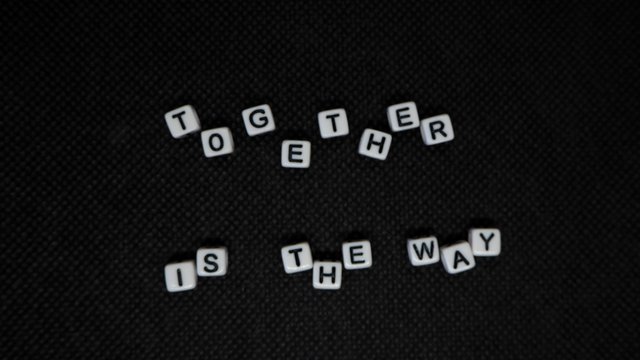 together is the way schriftzug aus steinen